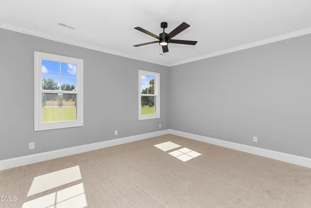 a view of a livingroom with a window and a ceiling fan