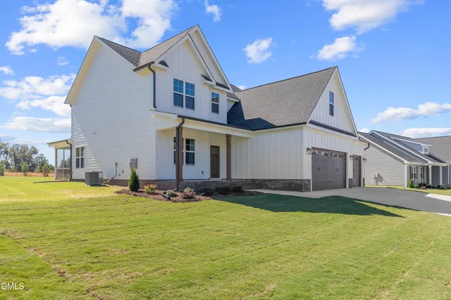 a house view with swimming pool and yard