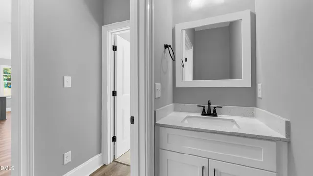 a bathroom with a sink and a mirror