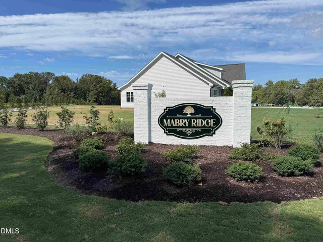 a view of outdoor space with garden and trees