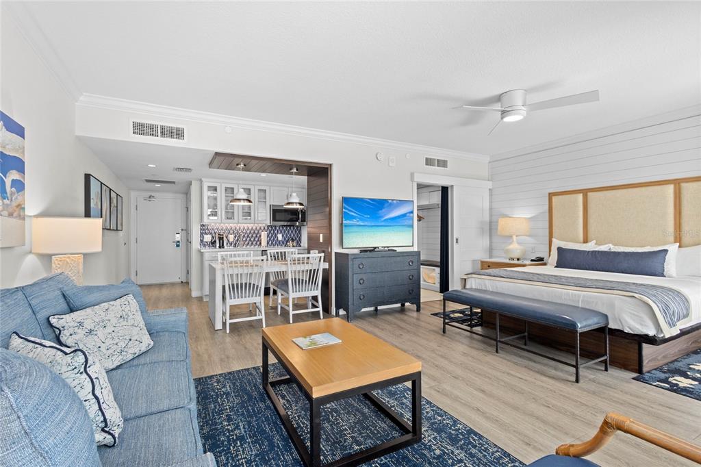 230 Sands Point Road, Unit 3205 Longboat Key, FL 34228 - Photo 16 of 38 a living room with furniture a rug and a table