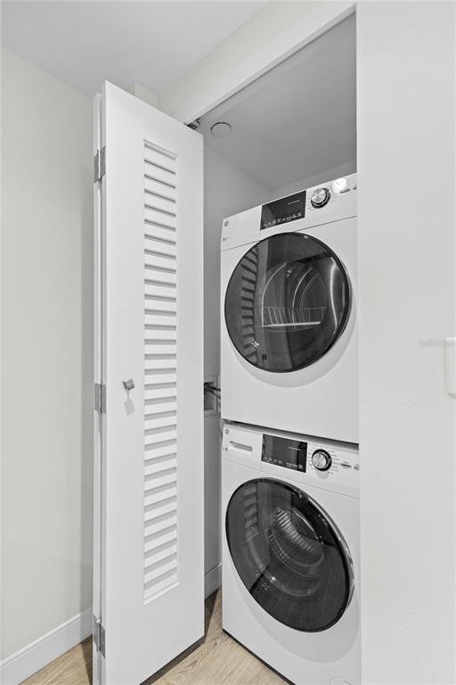 230 Sands Point Road, Unit 3205 Longboat Key, FL 34228 - Photo 21 of 38 a utility room with dryer and washer