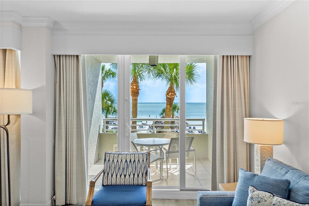 230 Sands Point Road, Unit 3205 Longboat Key, FL 34228 - Photo 7 of 38 a living room with furniture and a large window