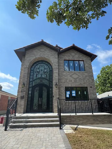 a view of a house with a small yard