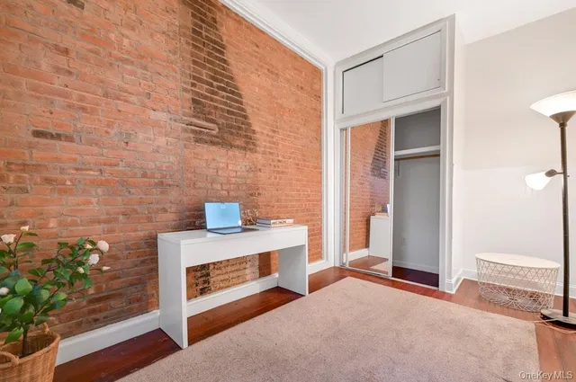 a view of a livingroom with an empty space and a fireplace