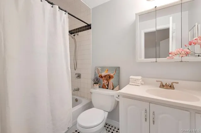 a white toilet sitting next to a bathroom sink