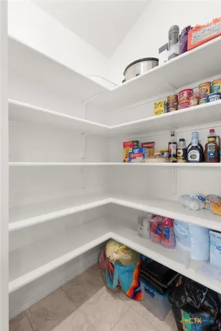 a room with a white wooden floor and shoes