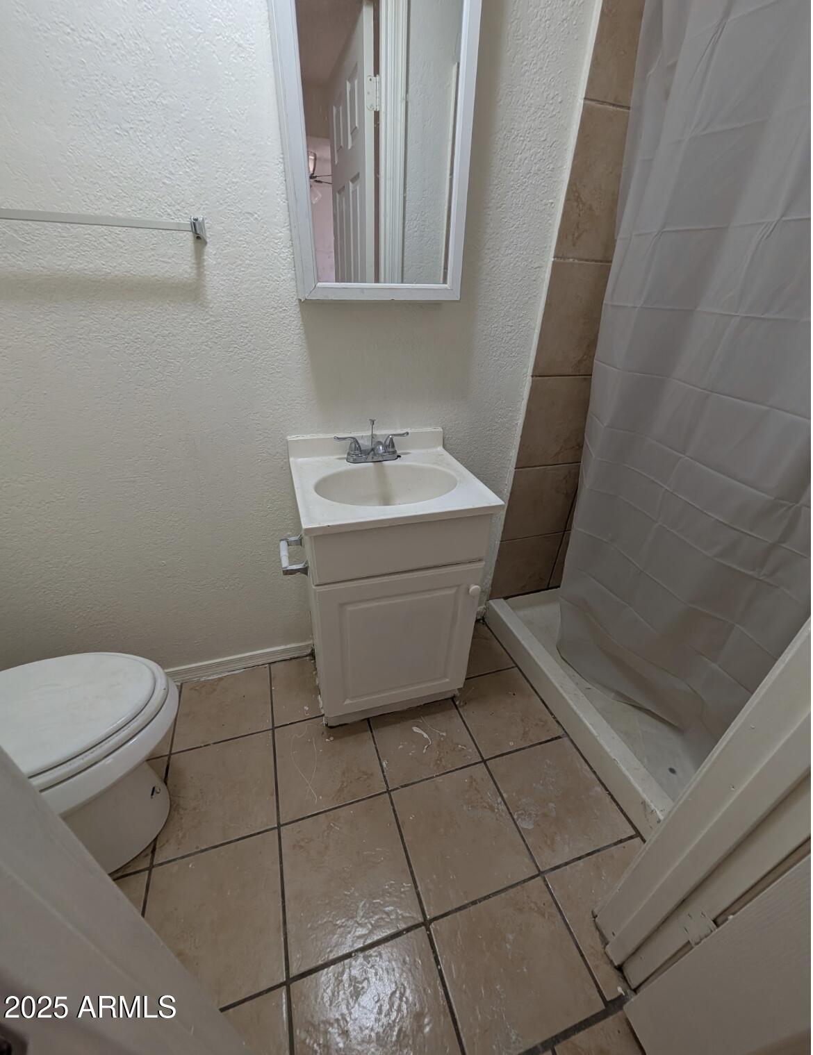 3302 East Thunderbird Road Phoenix, AZ 85032 - Photo 5 of 10 a bathroom with a sink and toilet