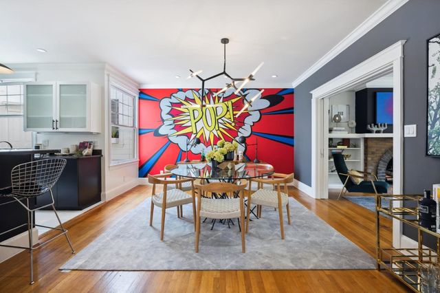 a dining room view with glass windows and furniture