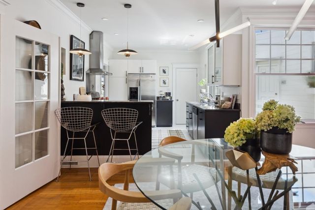 a vase of flowers sitting on a table