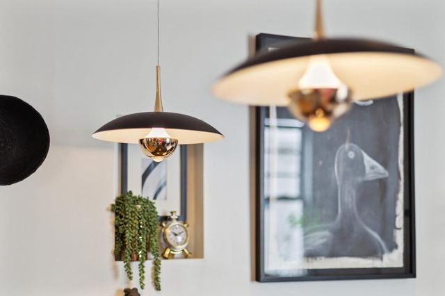 a kitchen with granite countertop a stove refrigerator and microwave