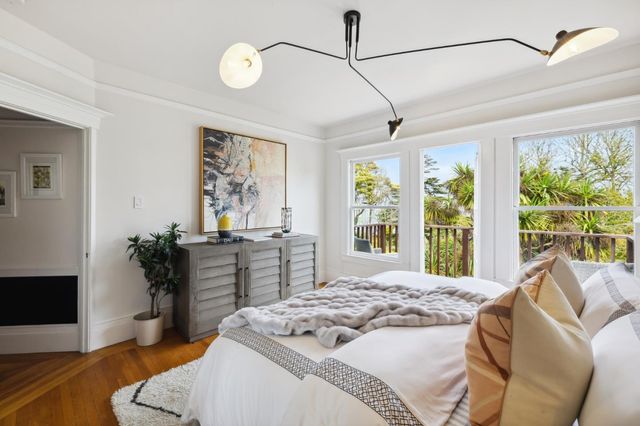 a view of a balcony with wooden fence