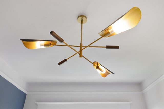 a living room with furniture and a book shelf