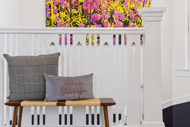 a view of a patio with couches table and chairs and potted plants