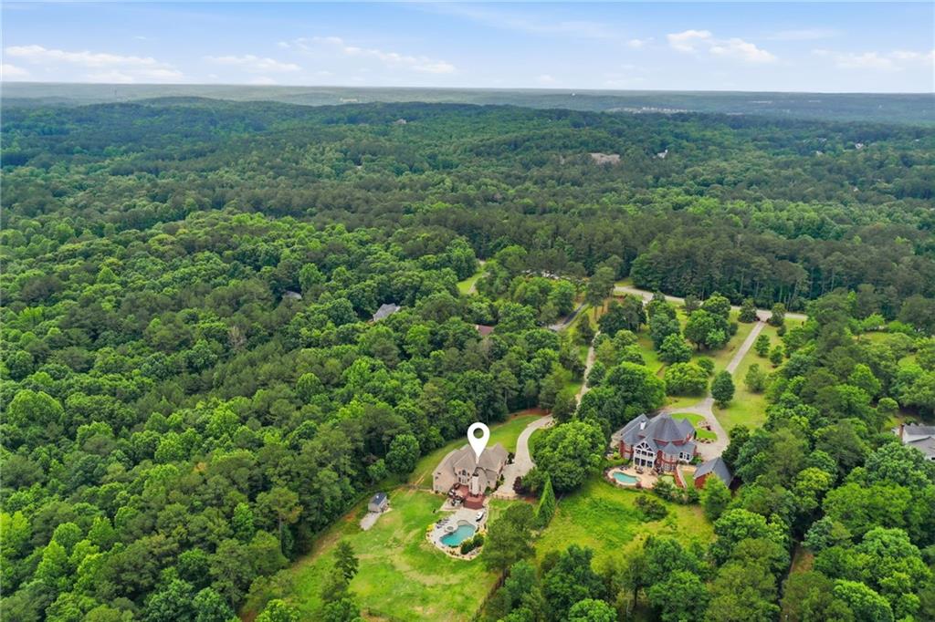 2950 Callie Still Road Lawrenceville, GA 30045 - Photo 65 of 77 an aerial view of residential houses with outdoor space and trees