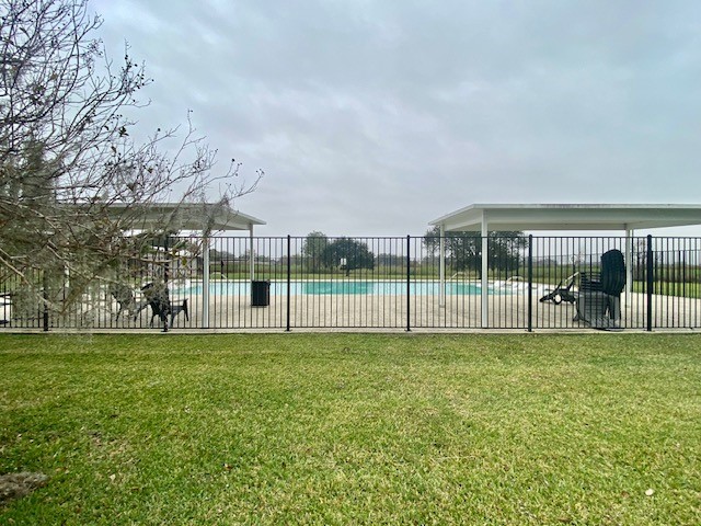 218 Cattle Drive Trail Angleton, TX 77515 - Photo 14 of 34 Another view of the pool area with areas with sit under cover.