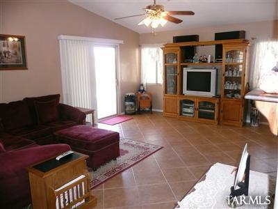 8421 Red Rock Ridge Court Tucson, AZ 85742 - Photo 4 of 16 a living room with furniture and a flat screen tv