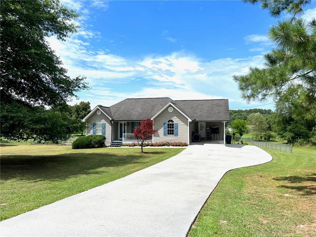 144 McCreary Road Southeast Calhoun, GA 30701 - Photo 1 of 1 a view of house with yard
