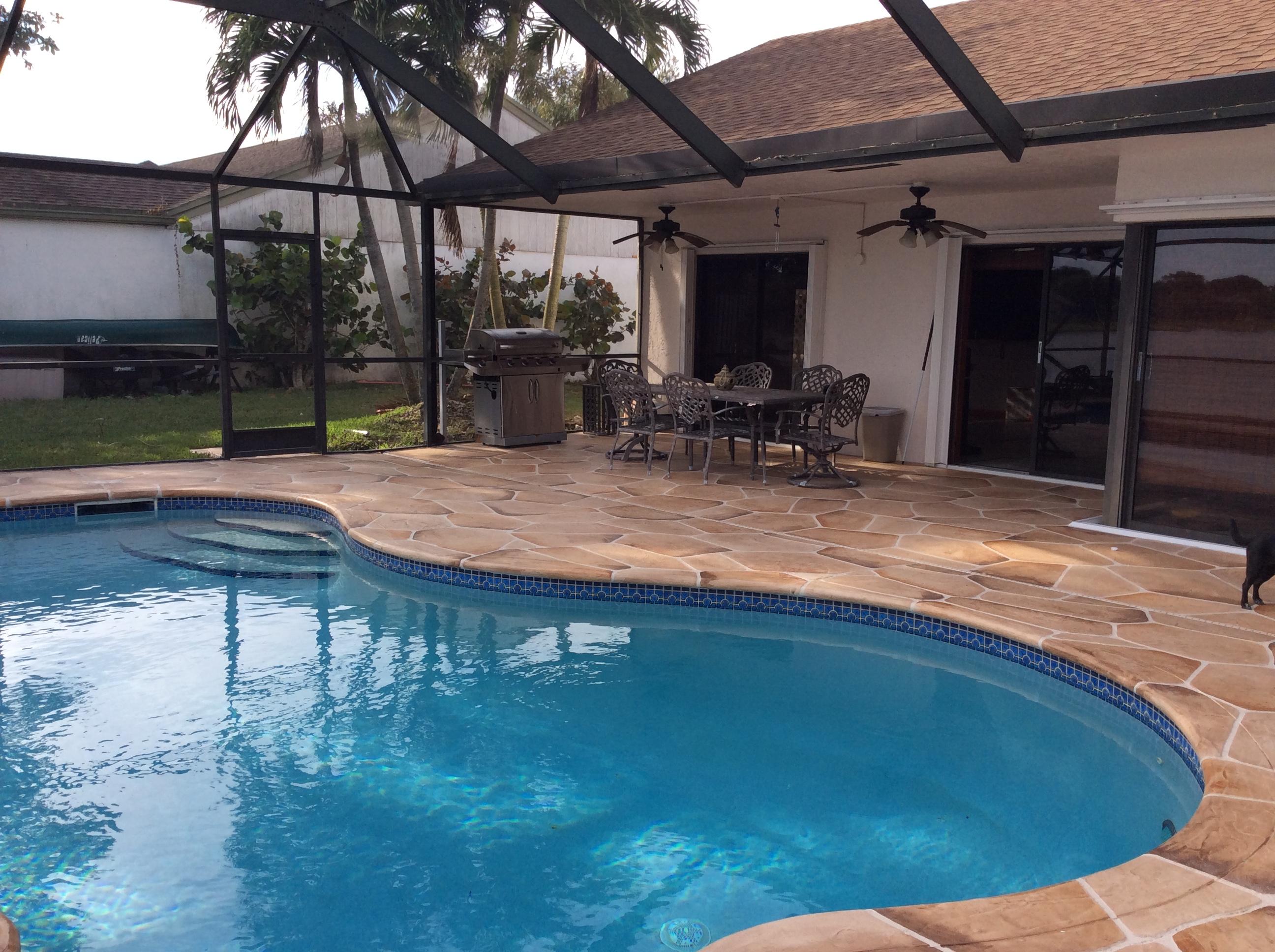 11584 Quiet Waters Lane Boca Raton, FL 33428 - Photo 25 of 31 covered pool patio