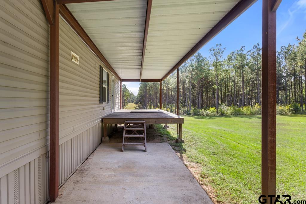 5379 County Road 385 Tyler, TX 75708 - Photo 41 of 44 a view of a two chairs and table in the balcony