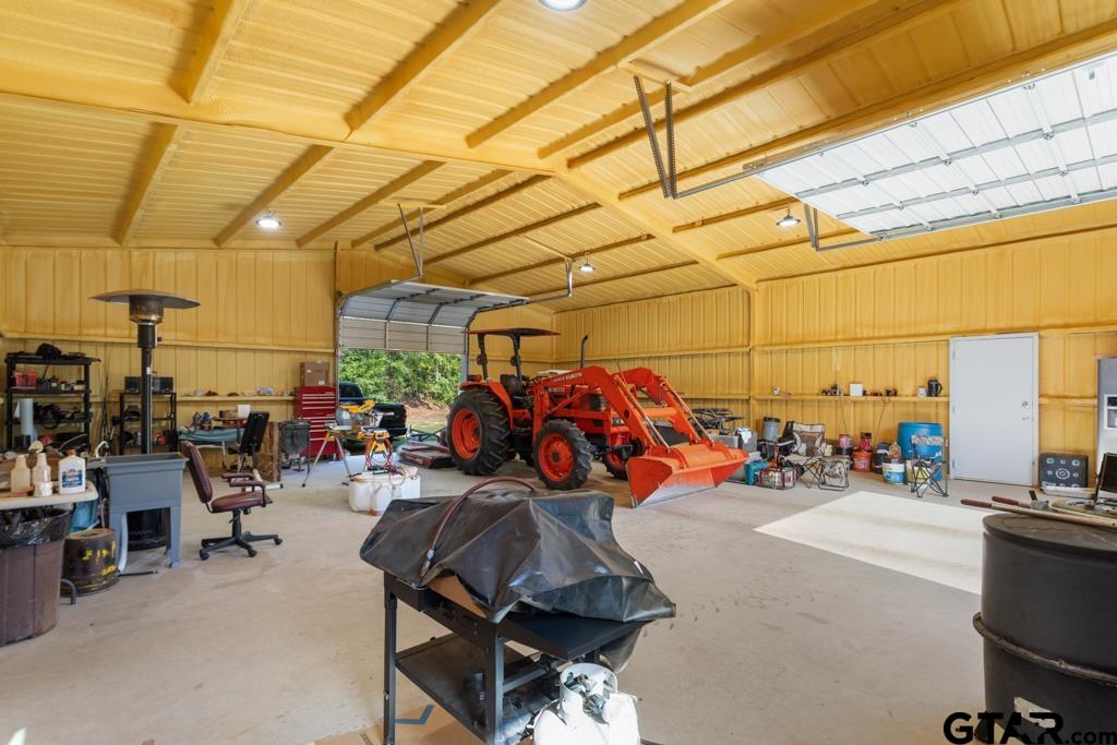 5379 County Road 385 Tyler, TX 75708 - Photo 43 of 44 a view of a garage with a bike and car
