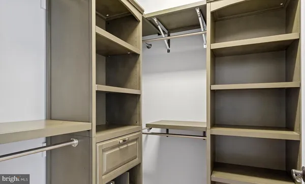 a view of an empty walk in closet