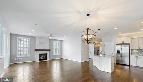 a view of a kitchen and a fireplace