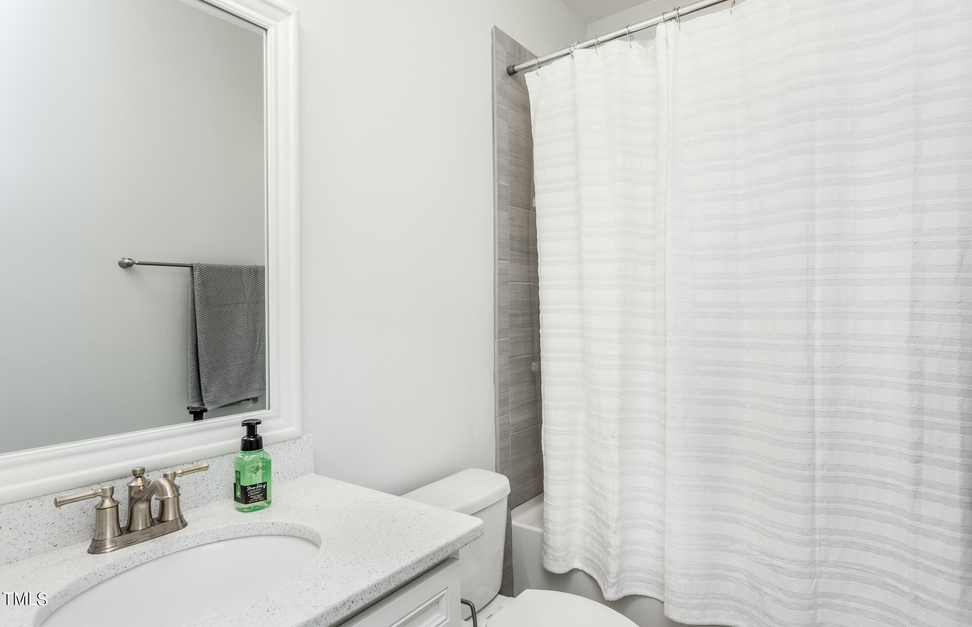 549 Fosterton Cottage Way Raleigh, NC 27603 - Photo 18 of 26 a bathroom with a sink and a mirror