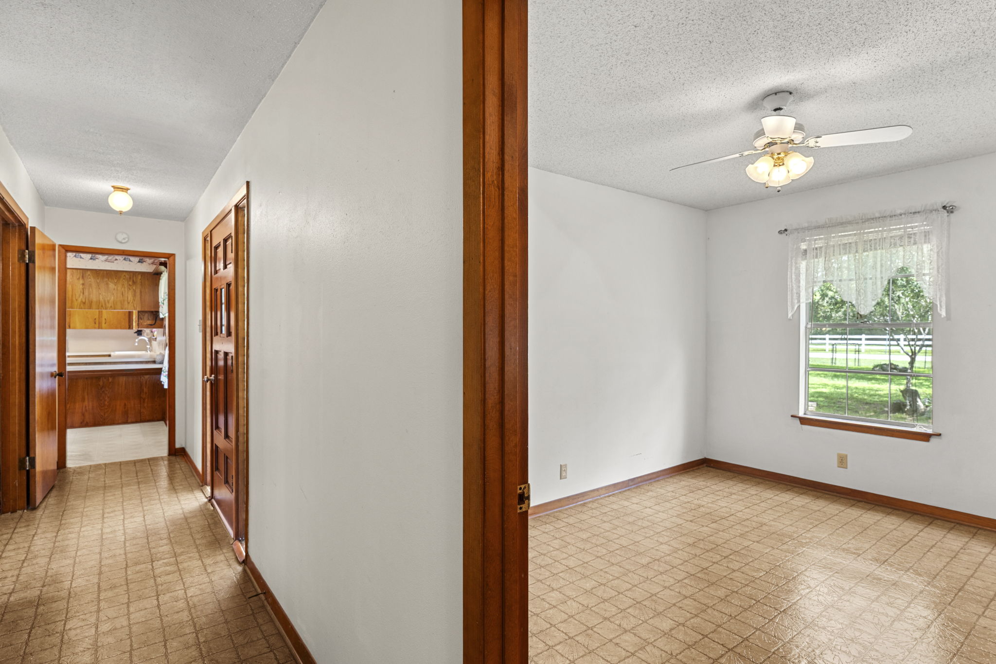3511 Wyldwood Road Austin, TX 78739 - Photo 21 of 40 Corridor featuring a textured ceiling and tile patterned floors
