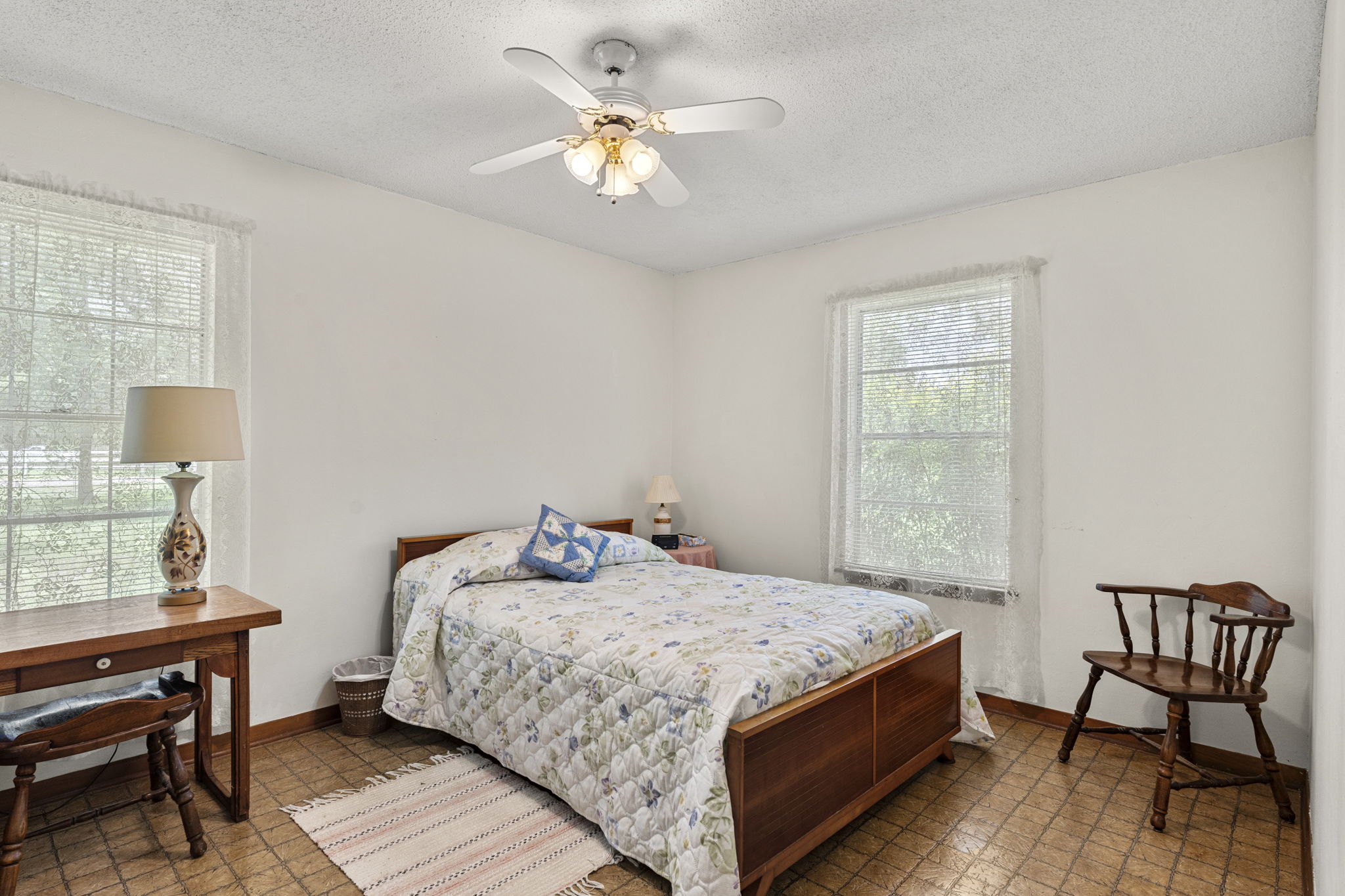 3511 Wyldwood Road Austin, TX 78739 - Photo 23 of 40 Bedroom with a textured ceiling, ceiling fan, and light flooring