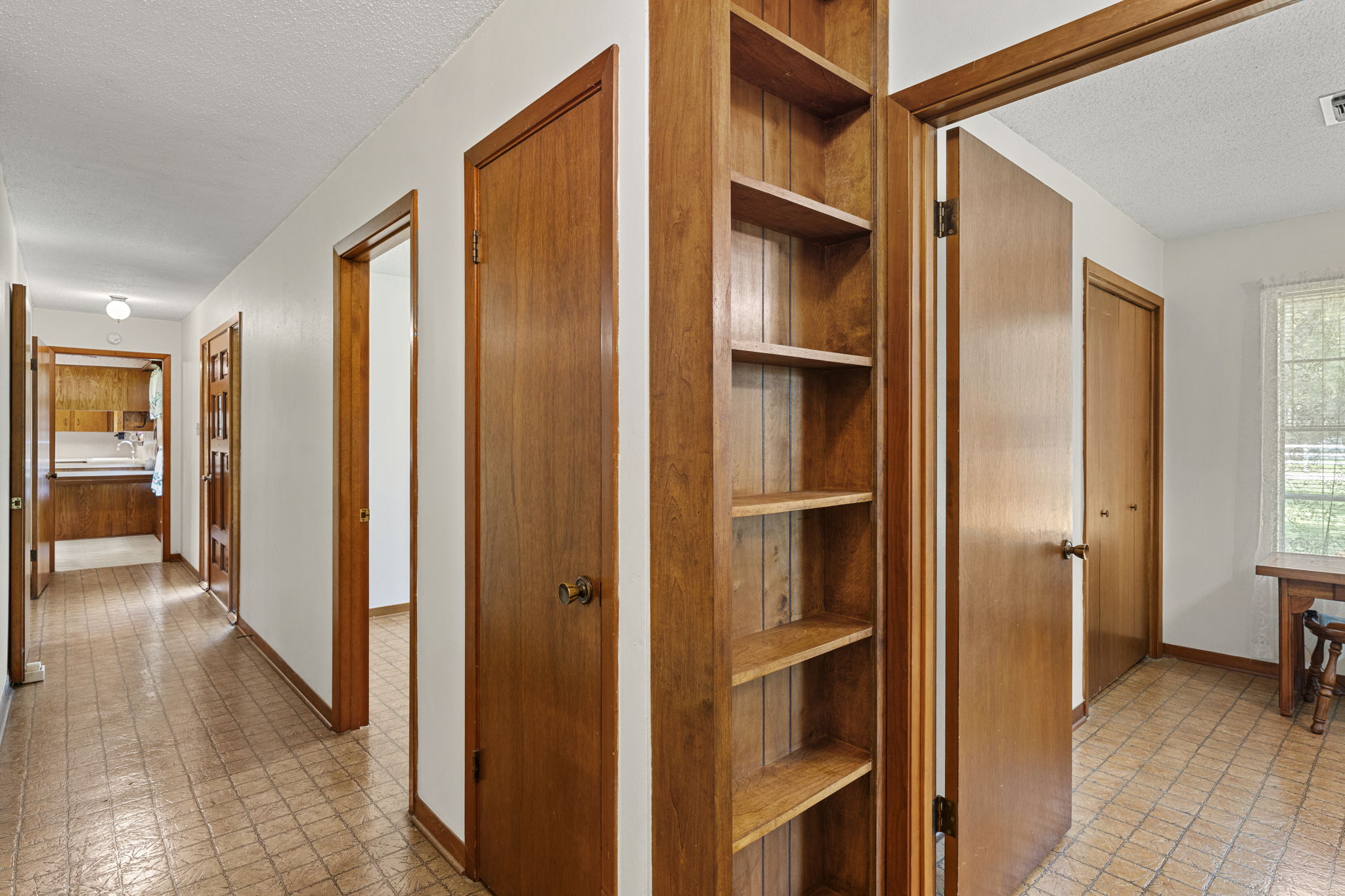 3511 Wyldwood Road Austin, TX 78739 - Photo 24 of 40 Hallway featuring a textured ceiling and built in features