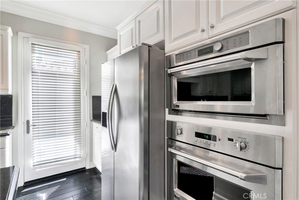 1 Via Santander San Clemente, CA 92673 - Photo 19 of 48 a kitchen with a stove microwave and refrigerator
