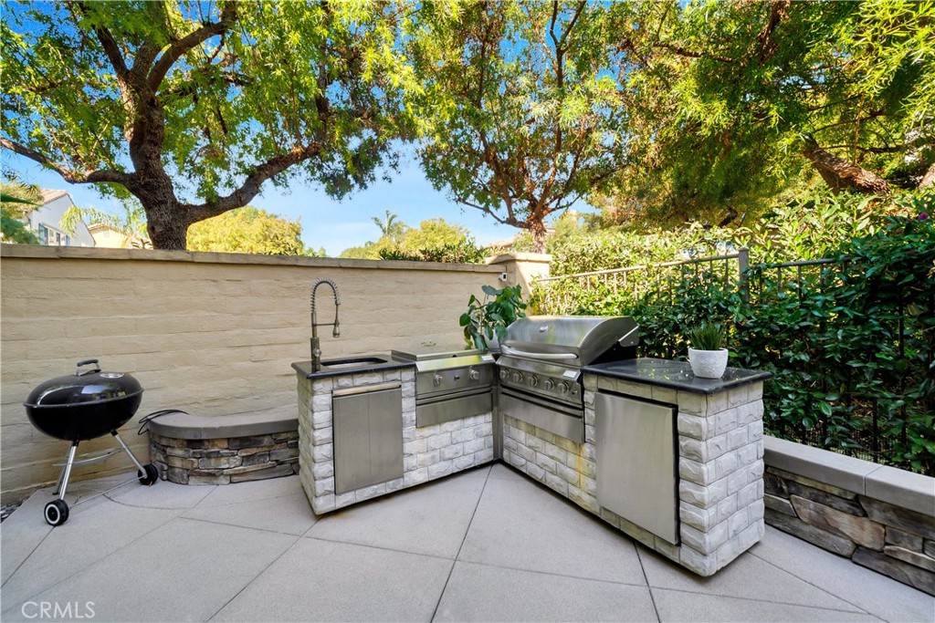 1 Via Santander San Clemente, CA 92673 - Photo 26 of 48 a view of a kitchen with a stove and a potted plant