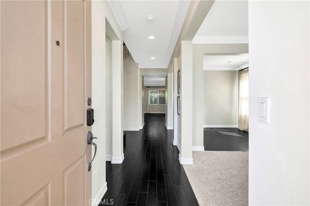 1 Via Santander San Clemente, CA 92673 - Photo 3 of 48 a view of a hallway with wooden floor and staircase