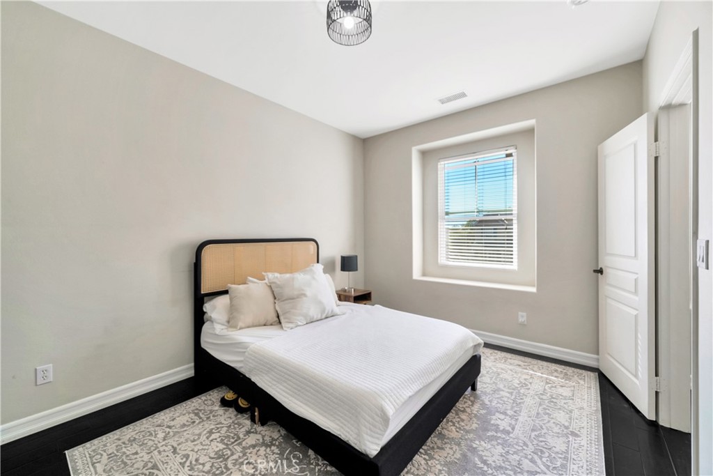 1 Via Santander San Clemente, CA 92673 - Photo 37 of 48 a bedroom with a bed and window