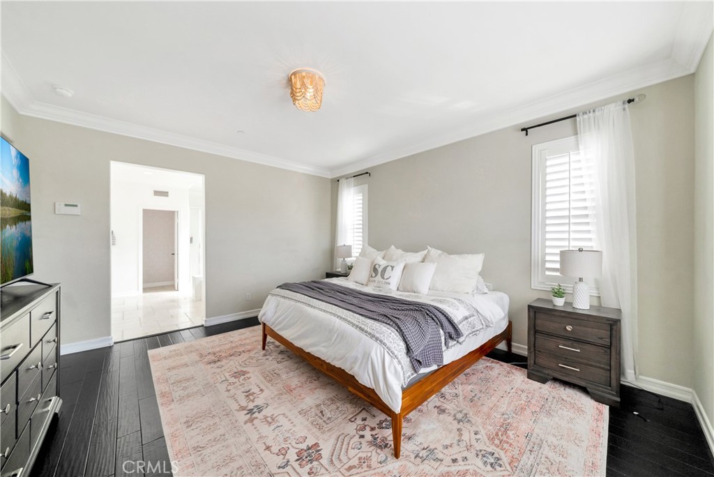 1 Via Santander San Clemente, CA 92673 - Photo 46 of 48 a spacious bedroom with a bed and a flat screen tv