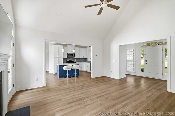 a view of kitchen with furniture and wooden floor