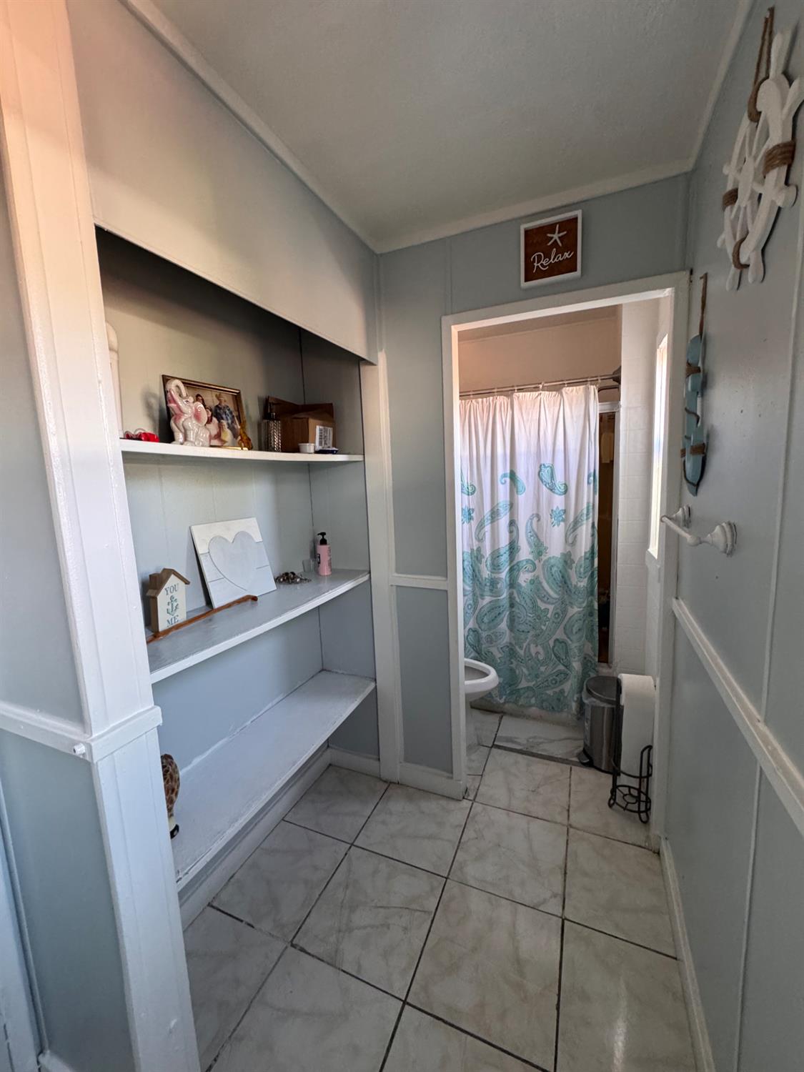 436 North Mercey Springs Road, Unit 154 Los Banos, CA 93635 - Photo 12 of 23 a kitchen with a refrigerator and a window