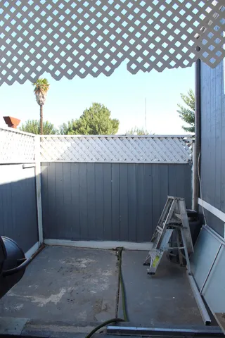 a view of backyard with seating space