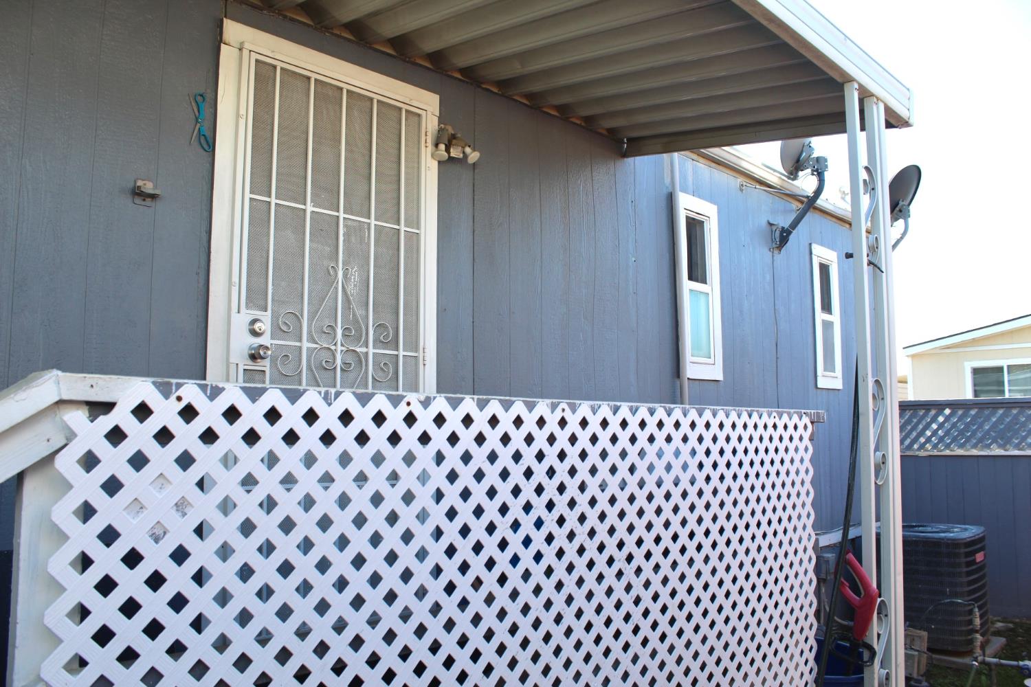 436 North Mercey Springs Road, Unit 154 Los Banos, CA 93635 - Photo 22 of 23 a front view of a house