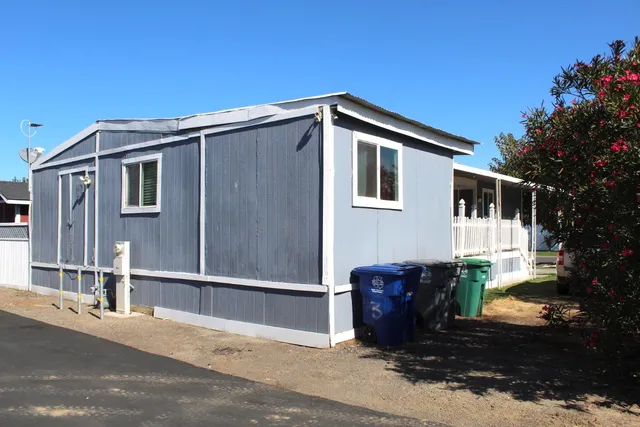 a front view of a house with parking space