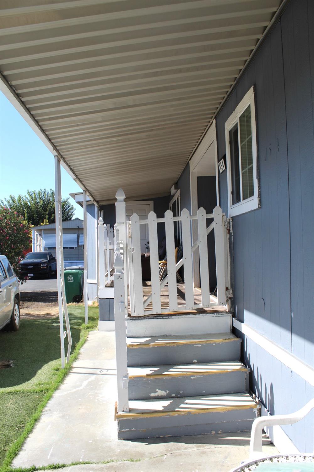 436 North Mercey Springs Road, Unit 154 Los Banos, CA 93635 - Photo 4 of 23 a view of house with entryway and stairs