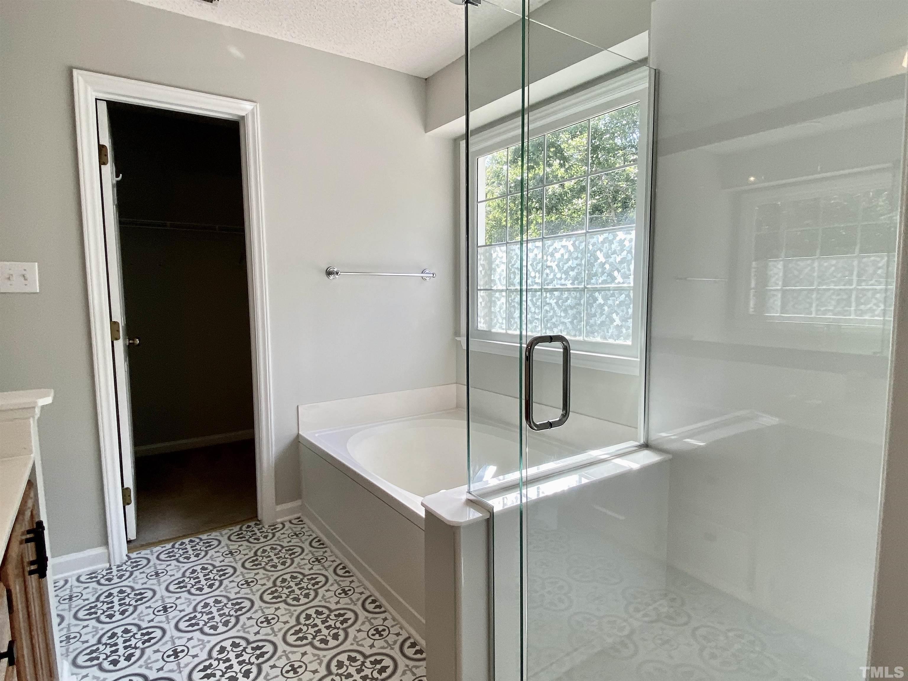 302 Bebington Drive Cary, NC 27513 - Photo 18 of 27 a bathroom with a shower