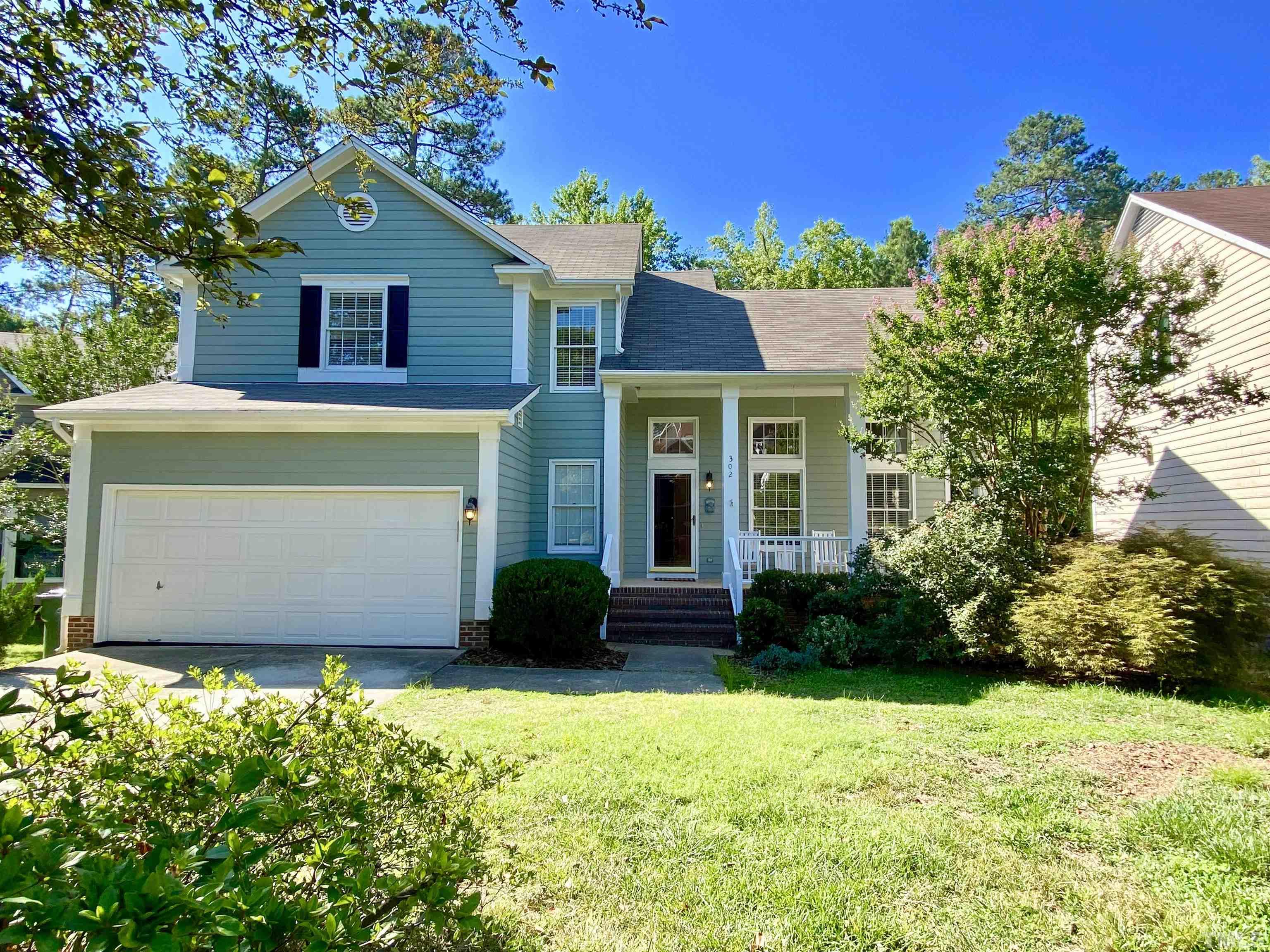 302 Bebington Drive Cary, NC 27513 - Photo 2 of 27 a view of a house with potted plants and a yard