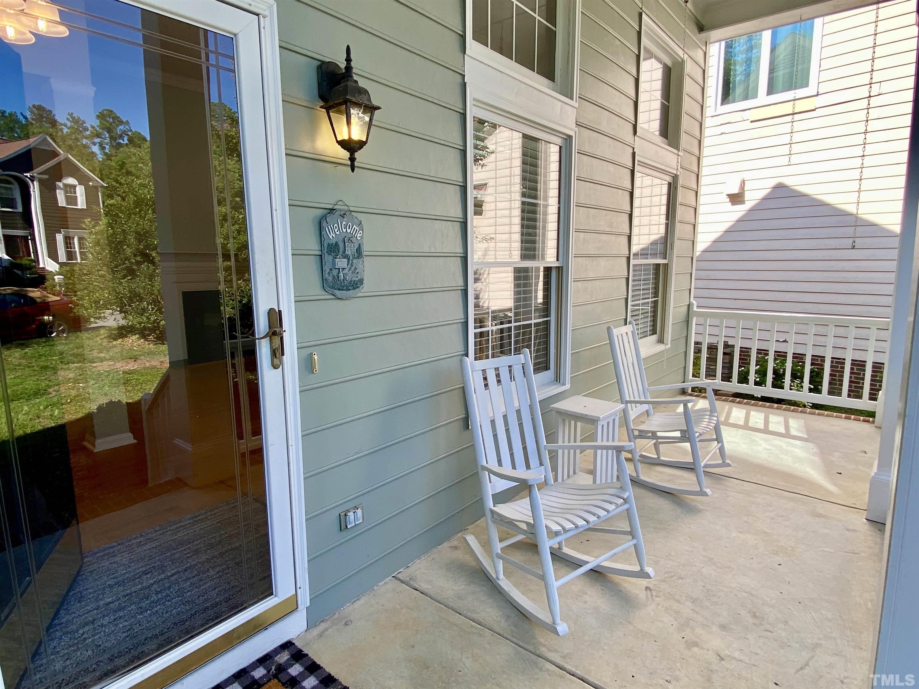 302 Bebington Drive Cary, NC 27513 - Photo 4 of 27 a view of balcony with two chairs and a window