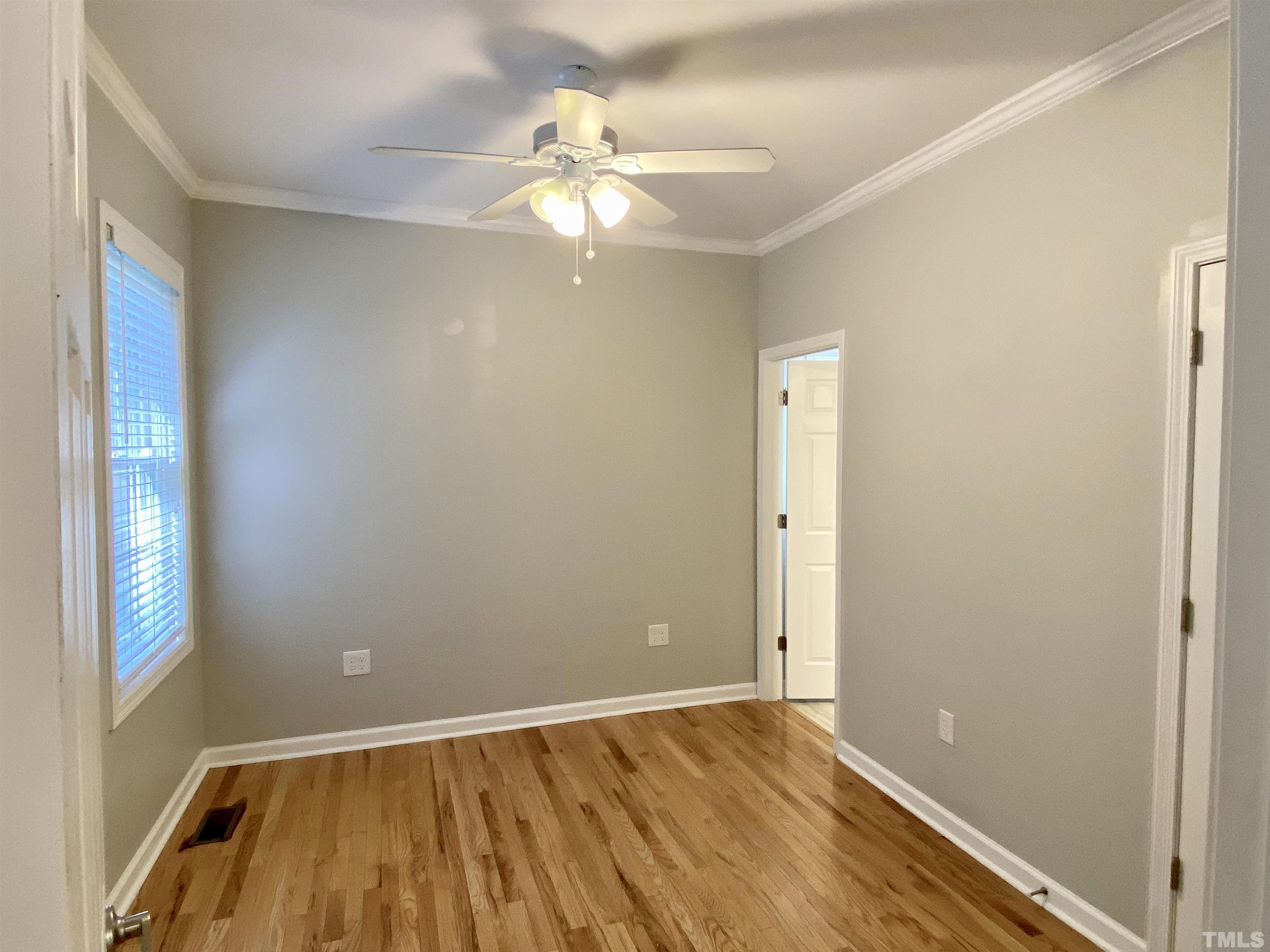 302 Bebington Drive Cary, NC 27513 - Photo 9 of 27 a view of an empty room with wooden floor