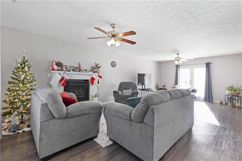 284 Oak Ridge Auburn, GA 30011 - Photo 3 of 13 a living room with furniture and a chandelier