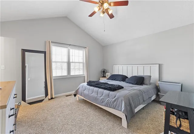 a bedroom with bed and window