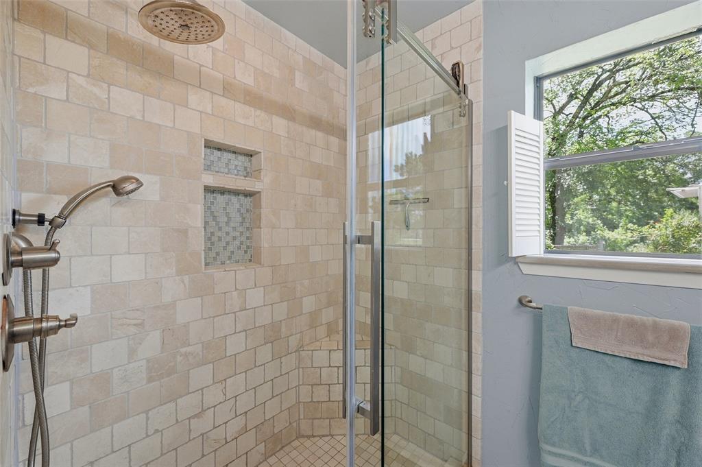 522 High Country Road Sherman, TX 75092 - Photo 18 of 38 a bathroom with a shower and a window