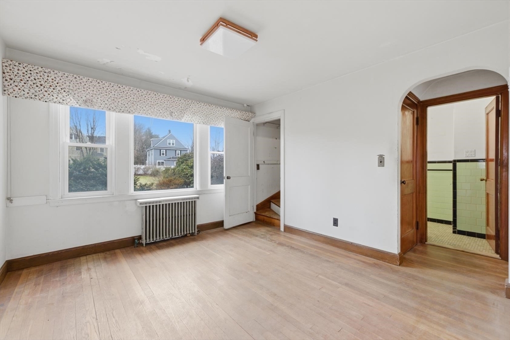 11 Clark Avenue Walpole, MA 02081 - Photo 11 of 25 a view of an empty room with a window